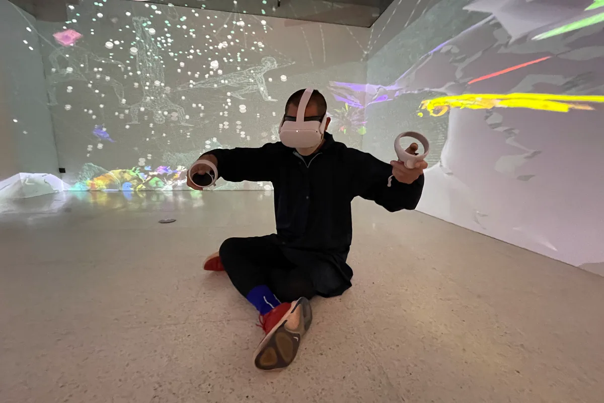 Inside the VR room, seated in the middle of the performance