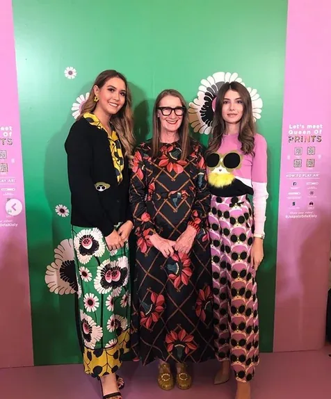Orla Kiely with guests at the AR photo backdrop.
