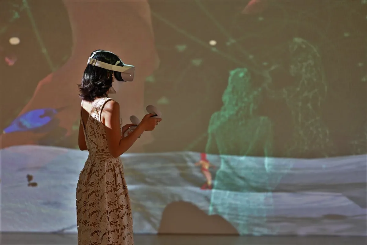 A visitor moving through the captured choreography