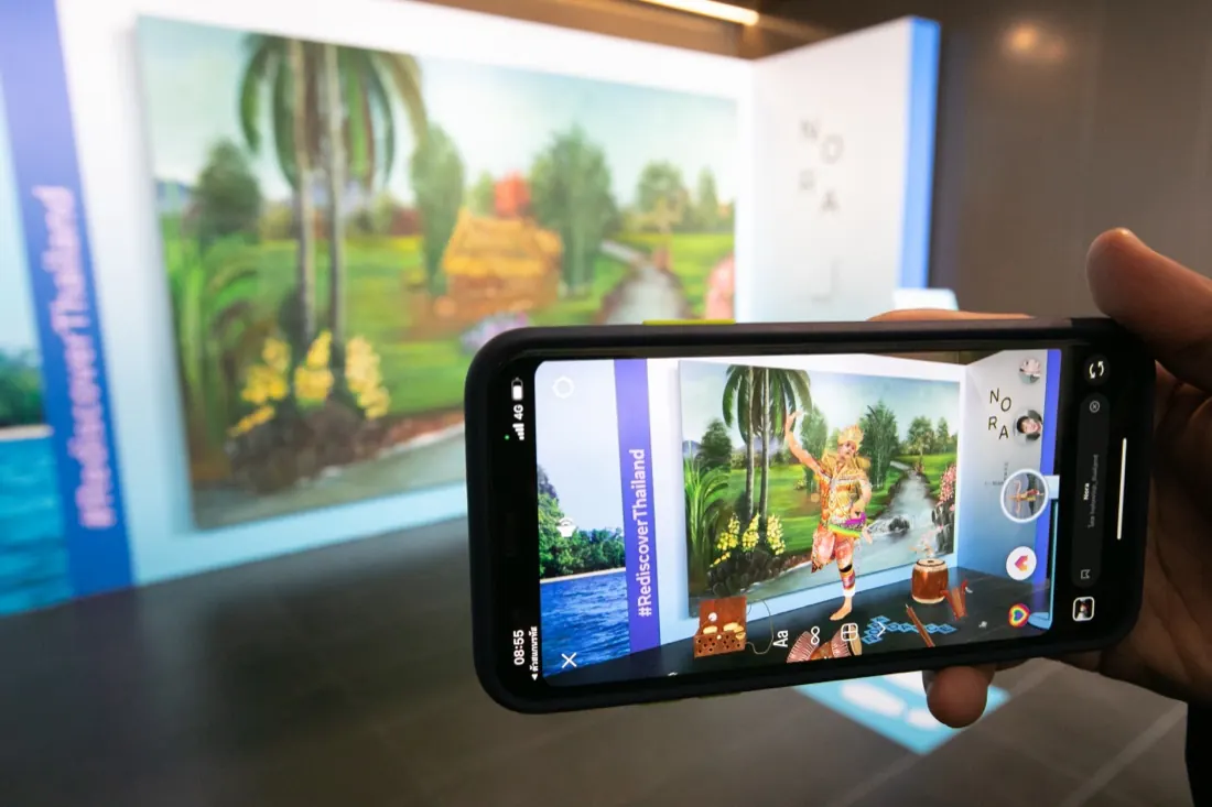 The AR route running on a phone against the exhibition mural
